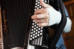 Closeup of hand and bellows strap